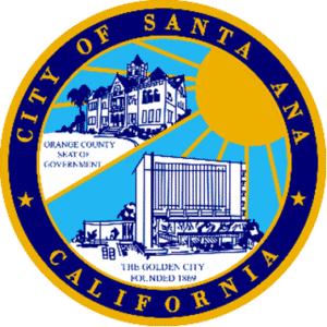 City of Santa Ana, California seal with buildings, sun, and text: Orange County Seat of Government, The Golden City.